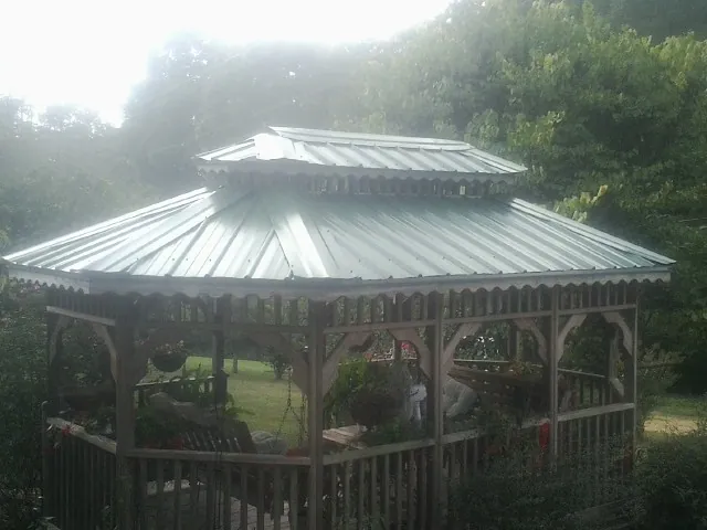 Two tier green metal roof on a garden gazebo in Bloomfield Hills